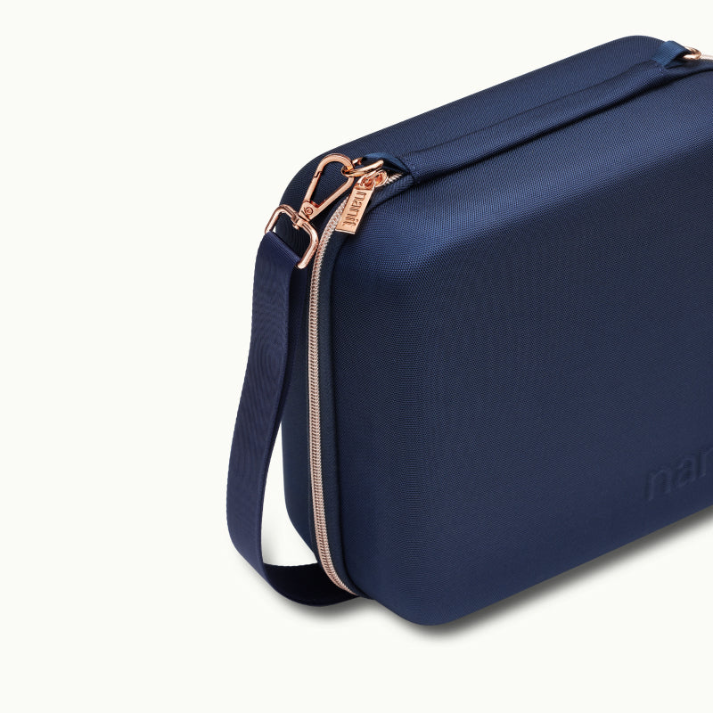 Angled shot of Nanit Traveling Light Case in blue oxford #color_blue oxford