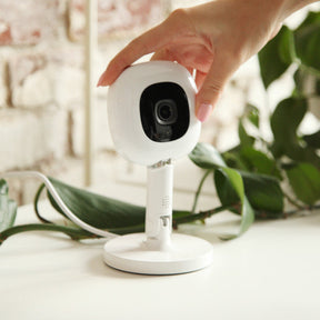 nanit pro camera being placed on flex stand